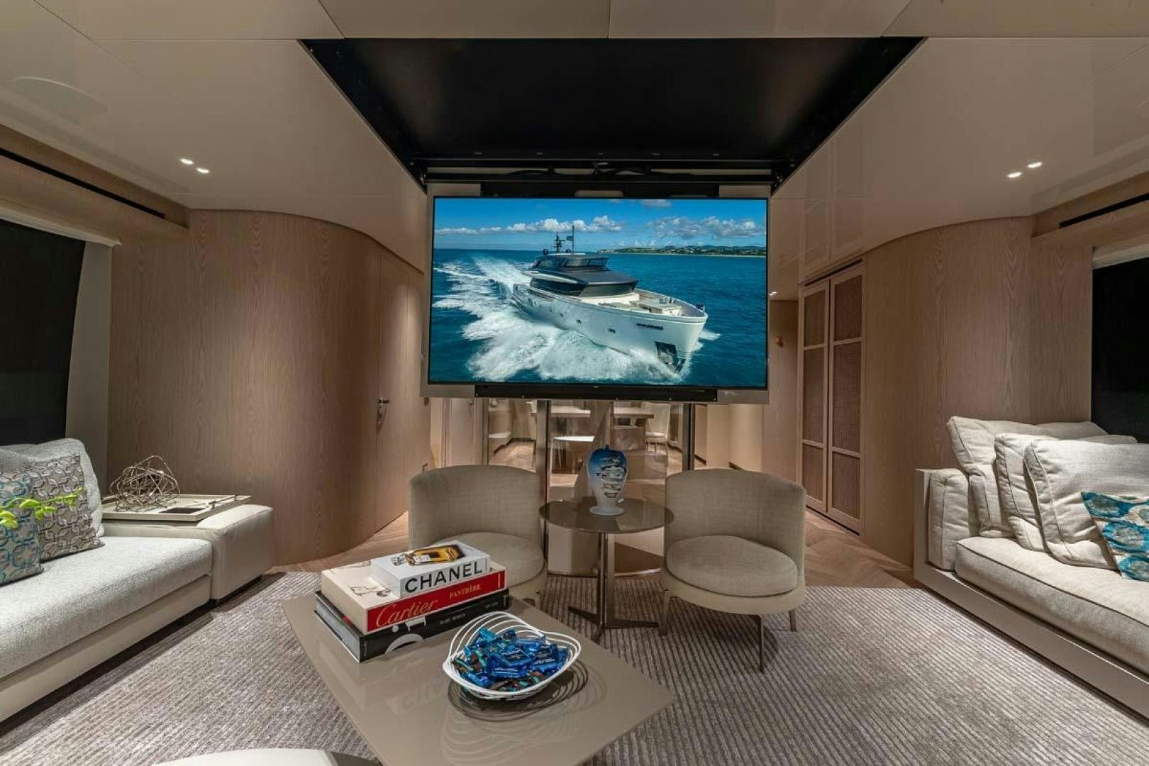 a living room with a large screen aboard ANOTHER ONE Yacht for Sale