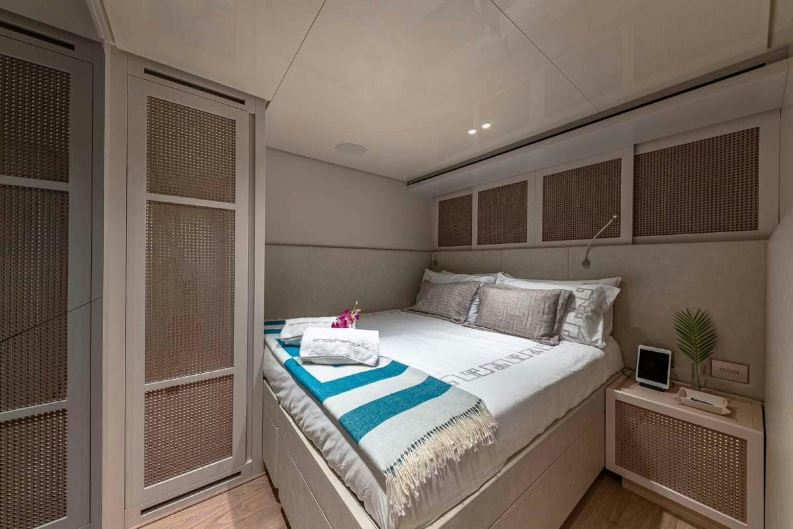 a bedroom with a bed and a television aboard ANOTHER ONE Yacht for Sale