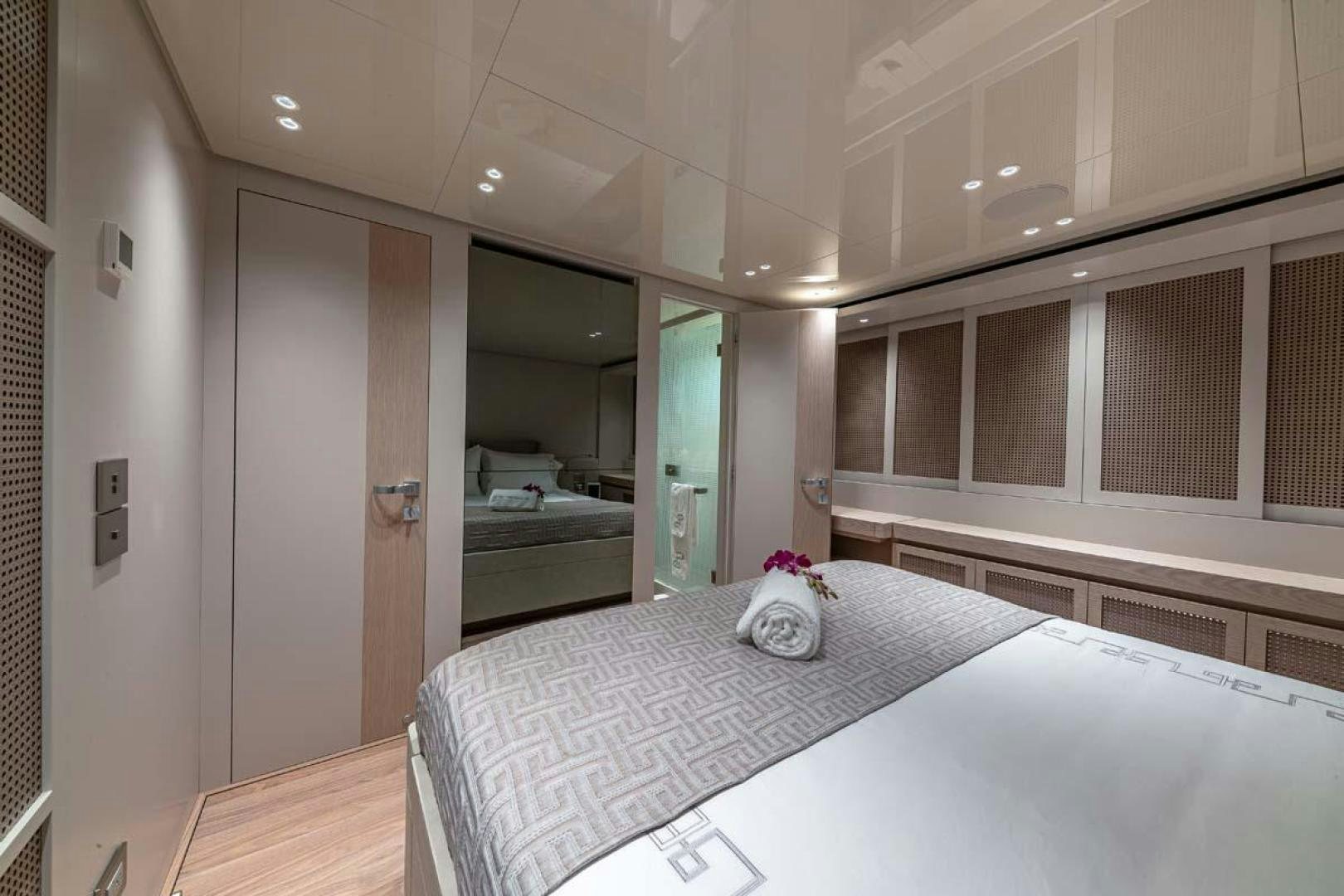 a bedroom with a bed and a closet aboard ANOTHER ONE Yacht for Sale