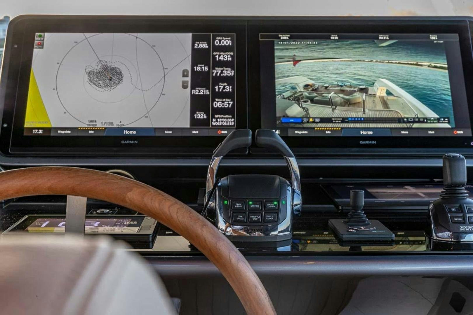 a hand holding a remote control in front of a computer screen aboard ANOTHER ONE Yacht for Sale