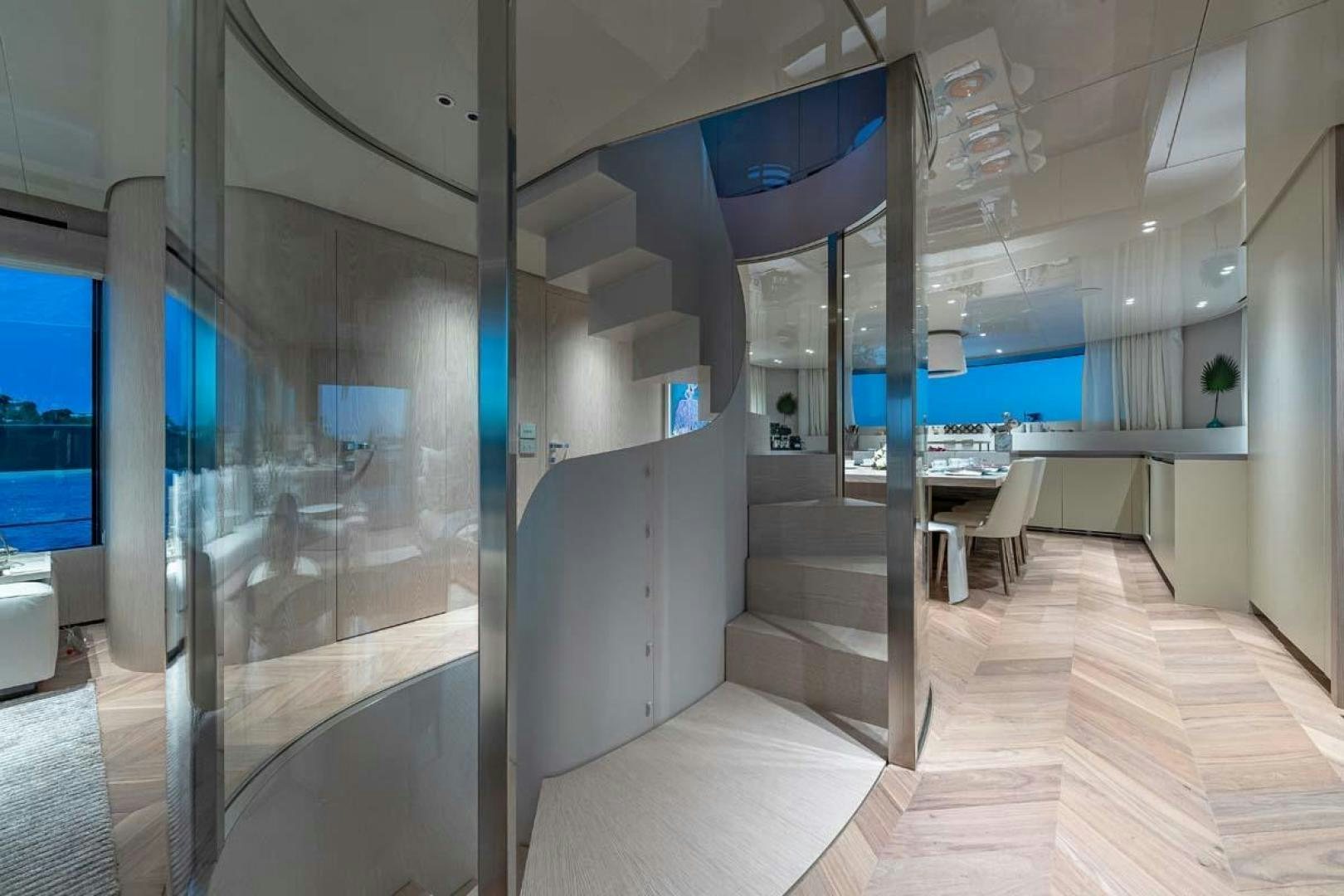 a room with a glass wall and a staircase aboard ANOTHER ONE Yacht for Sale