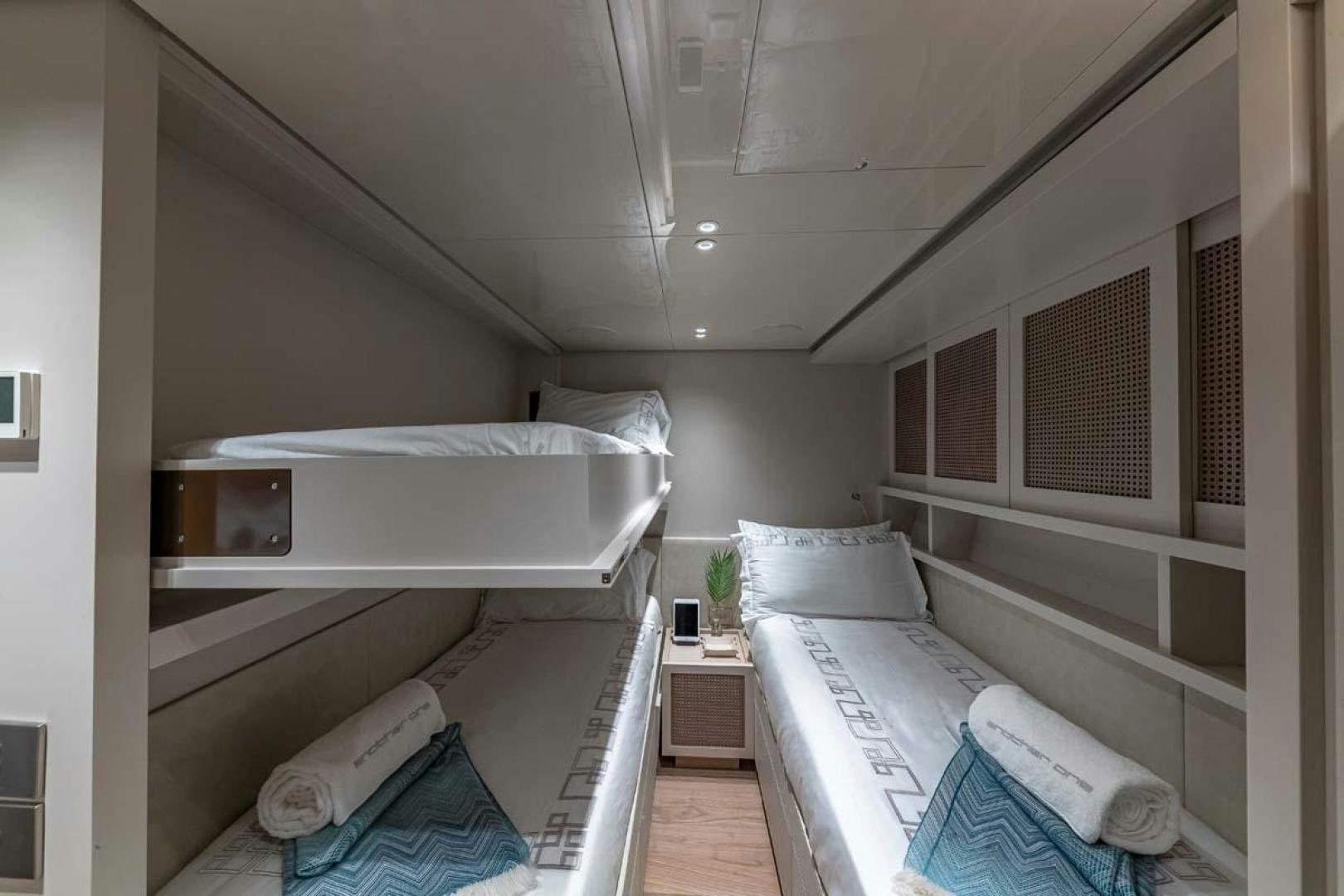 a room with white bunk beds aboard ANOTHER ONE Yacht for Sale