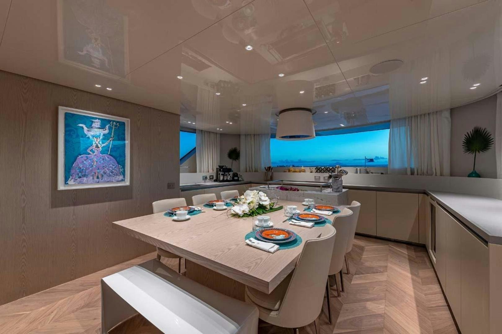 a modern kitchen with a large table aboard ANOTHER ONE Yacht for Sale