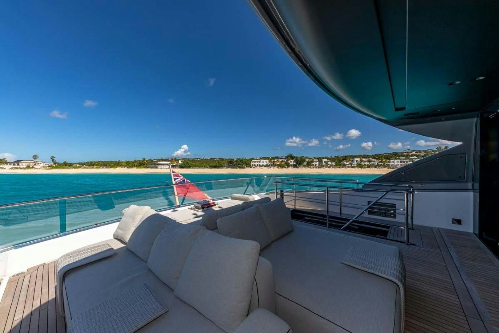 a deck with a view of the ocean and a beach aboard ANOTHER ONE Yacht for Sale