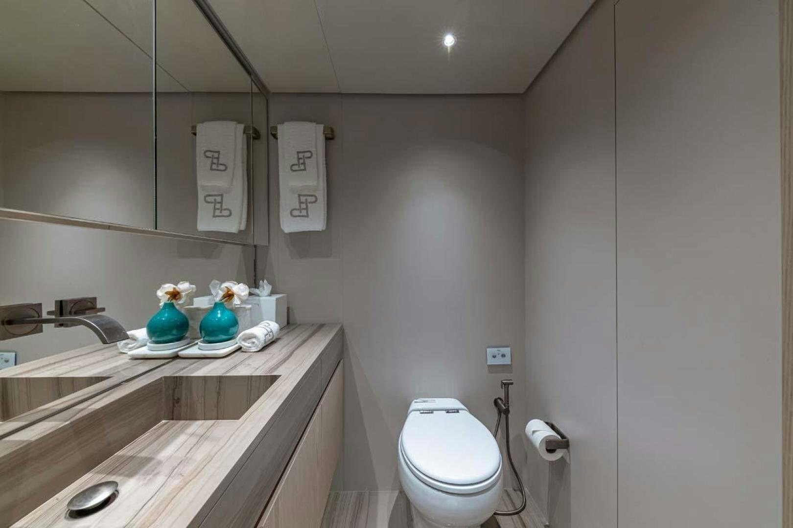 a bathroom with a sink toilet and a mirror aboard ANOTHER ONE Yacht for Sale