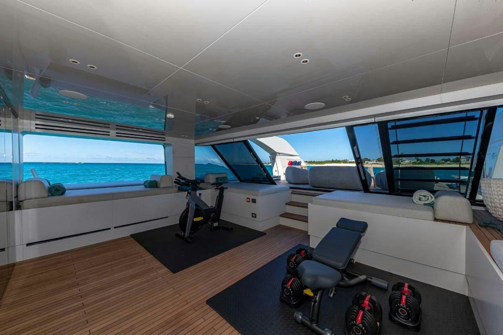 a room with a large window and a view of the water aboard ANOTHER ONE Yacht for Sale