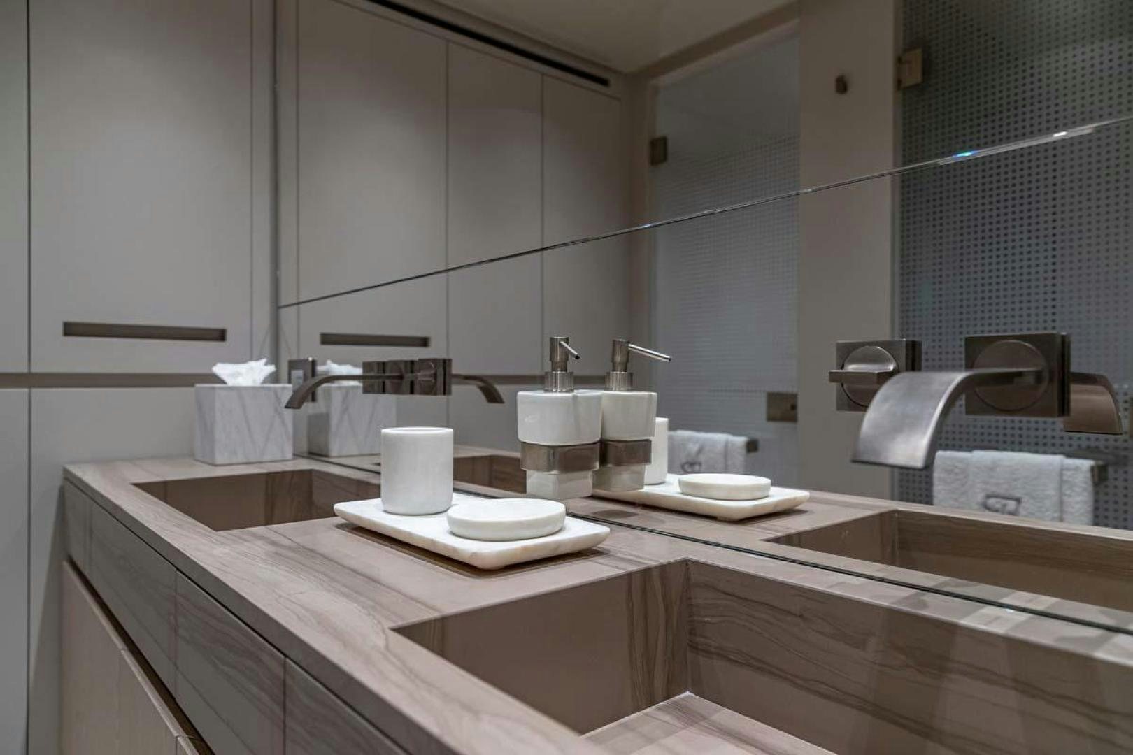 a bathroom with a large mirror aboard ANOTHER ONE Yacht for Sale