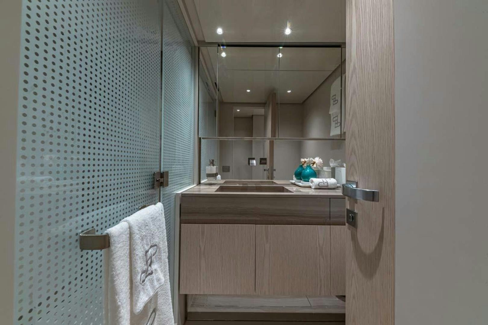 a bathroom with a sink and a mirror aboard ANOTHER ONE Yacht for Sale