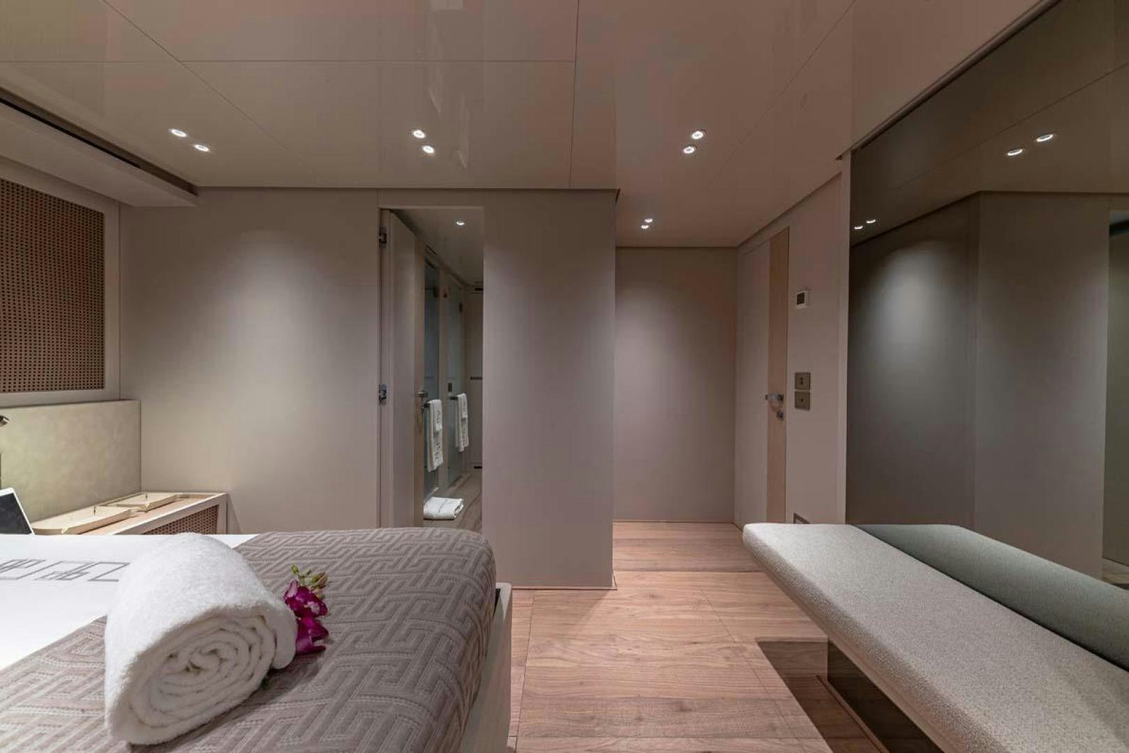 a room with a bed and a desk aboard ANOTHER ONE Yacht for Sale