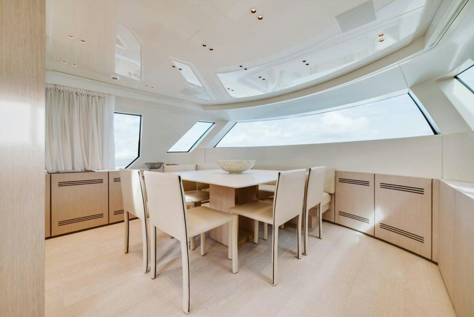 a room with a table and chairs aboard QUARANTENA Yacht for Sale