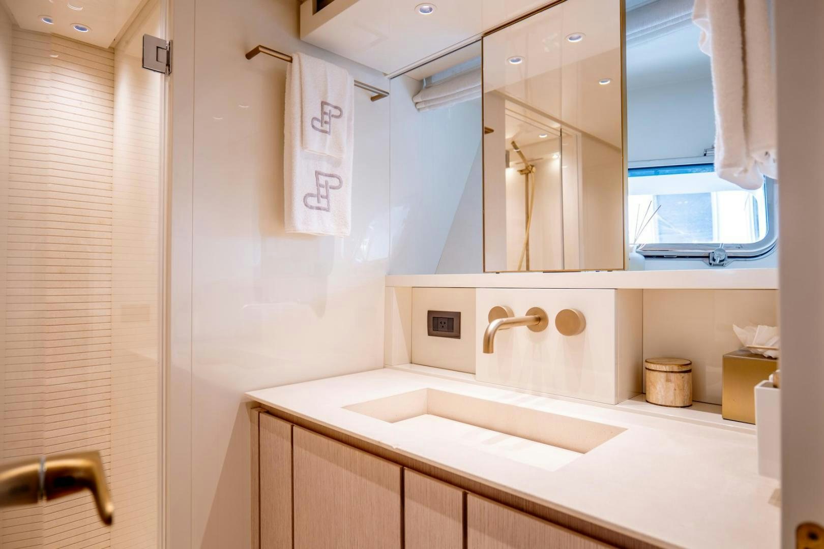 a bathroom with a sink and a mirror aboard QUARANTENA Yacht for Sale