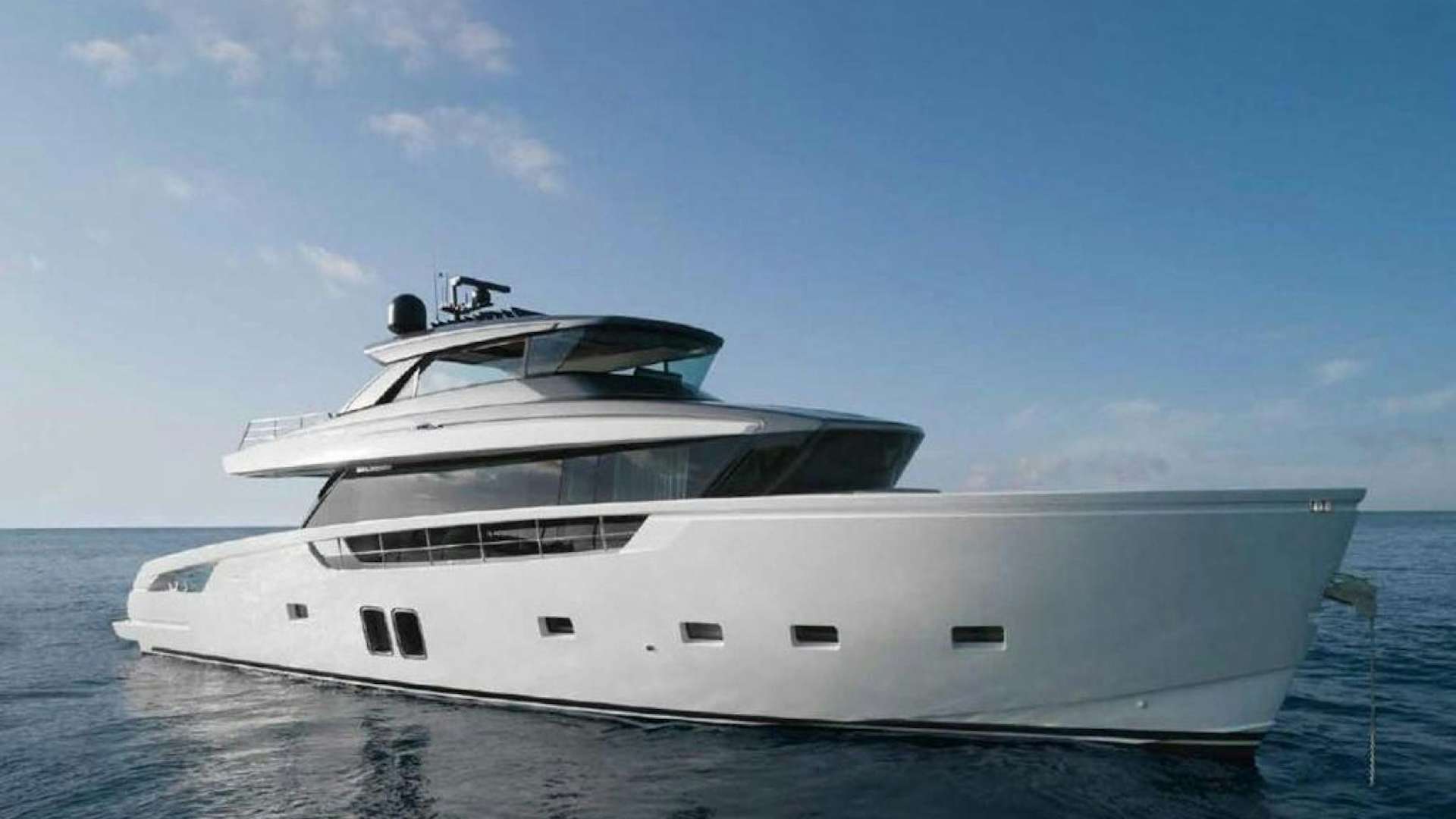 a white yacht on the water aboard QUARANTENA Yacht for Sale