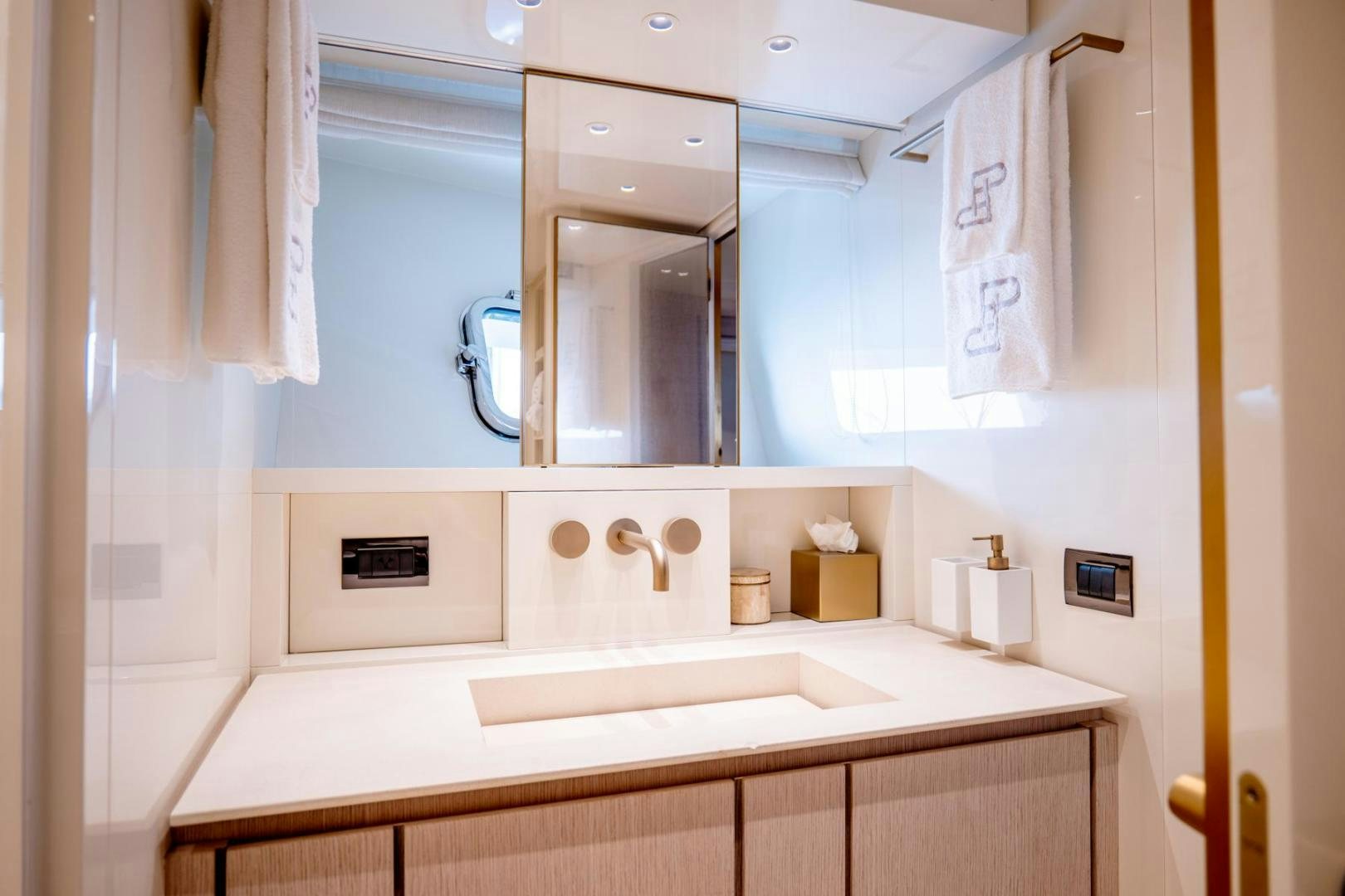 a bathroom with a large mirror aboard QUARANTENA Yacht for Sale