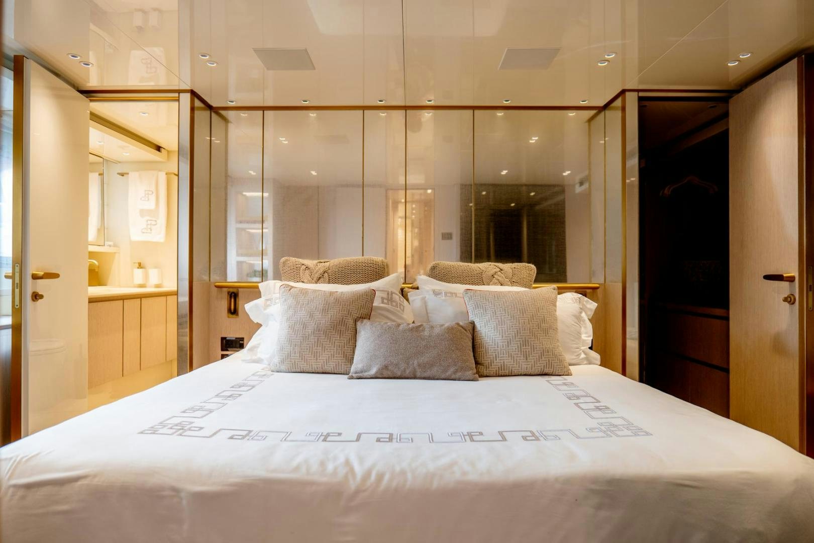 a bed with pillows aboard QUARANTENA Yacht for Sale