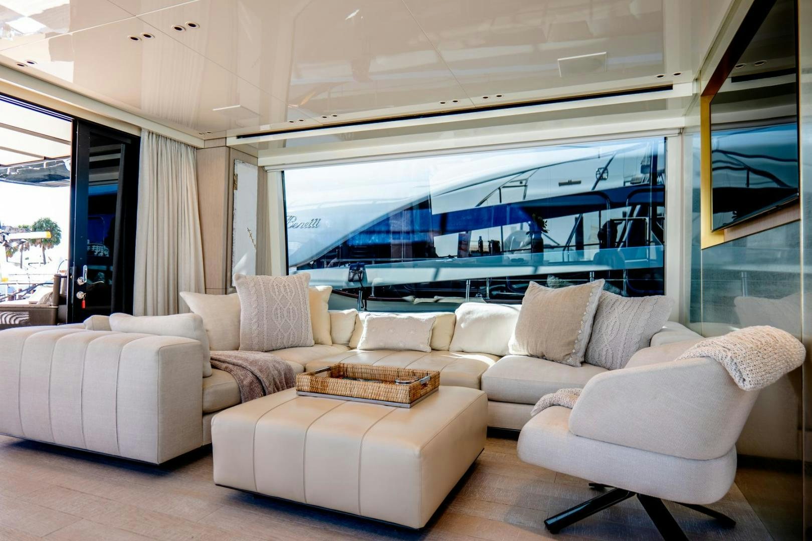 a living room with a large window aboard QUARANTENA Yacht for Sale