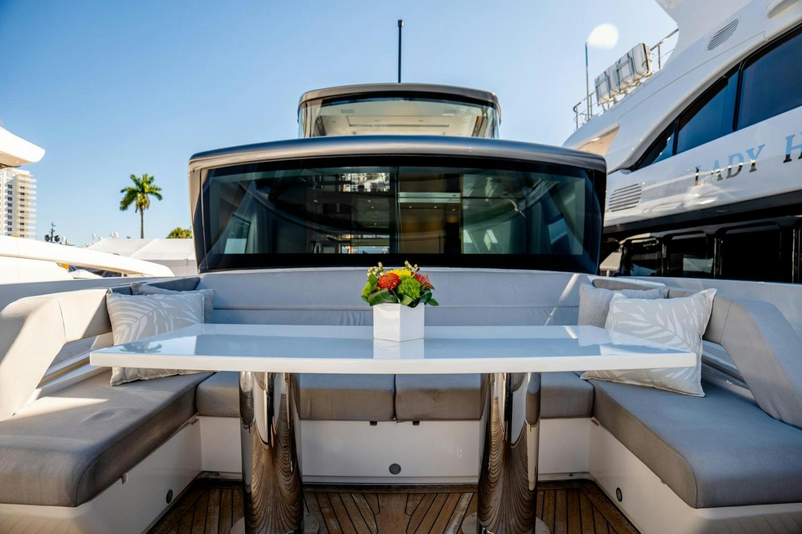 a boat with a table and a flower pot on it aboard QUARANTENA Yacht for Sale