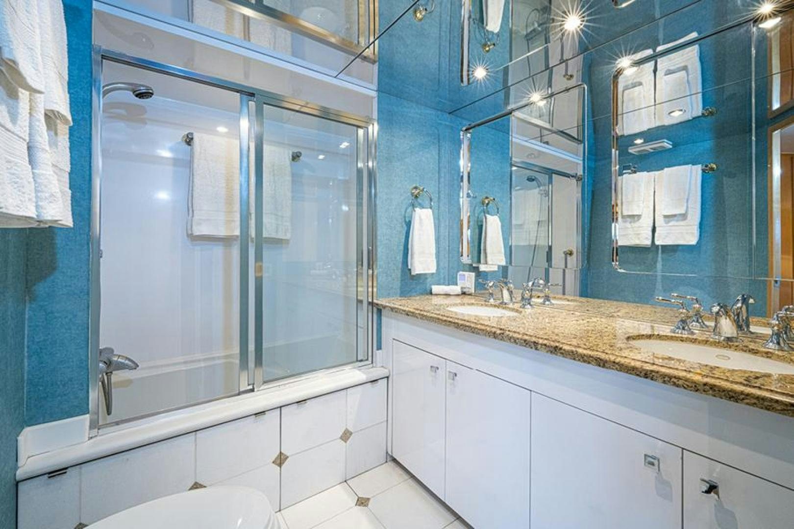 a bathroom with a large mirror aboard TUFF LIFE IV Yacht for Sale