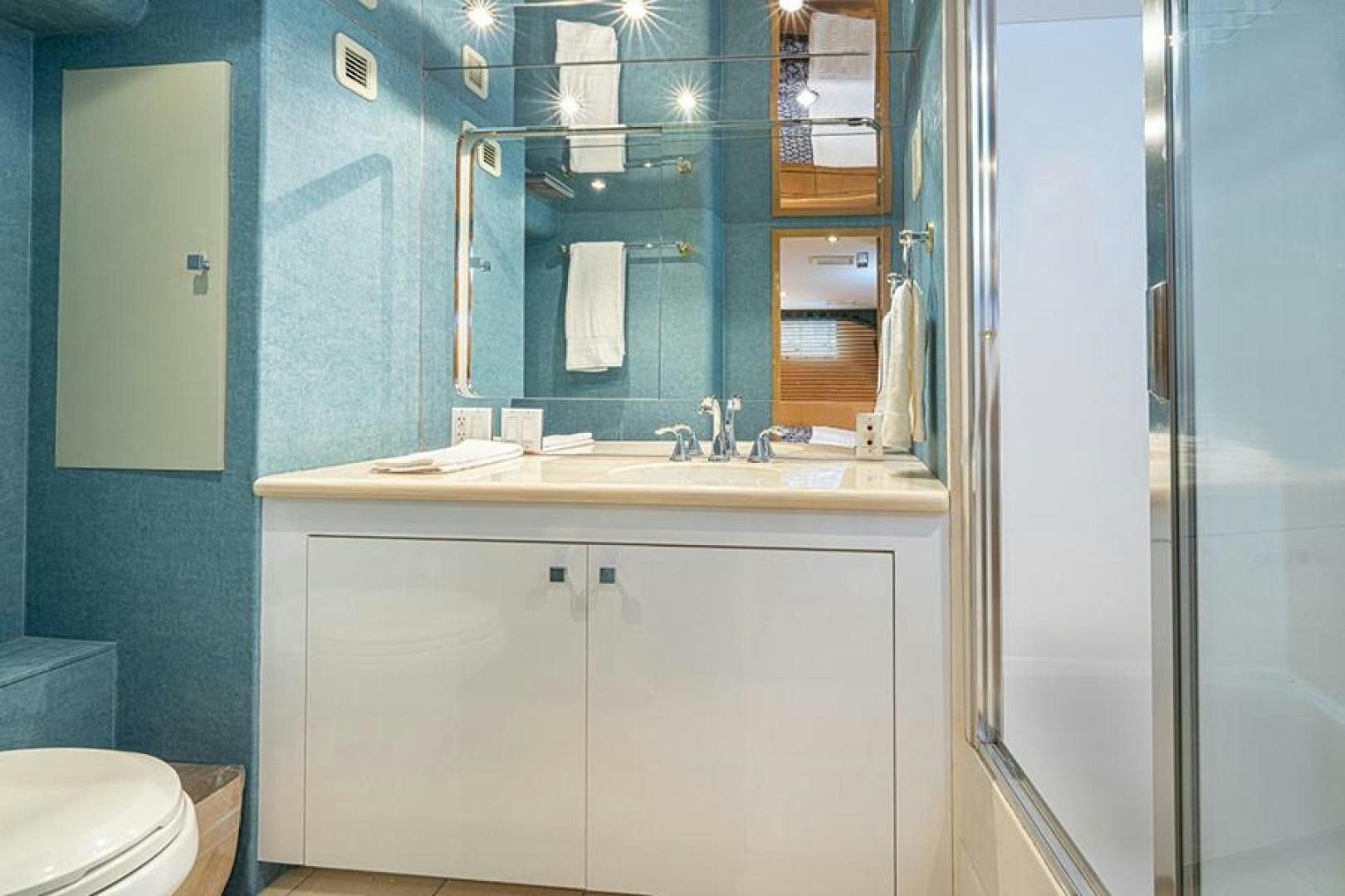 a bathroom with a sink and a mirror aboard TUFF LIFE IV Yacht for Sale