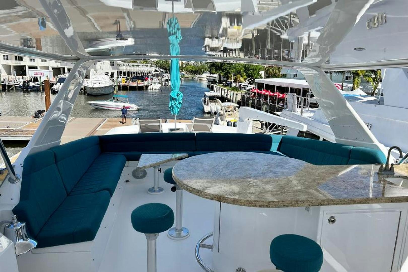 a large building with a pool aboard TUFF LIFE IV Yacht for Sale