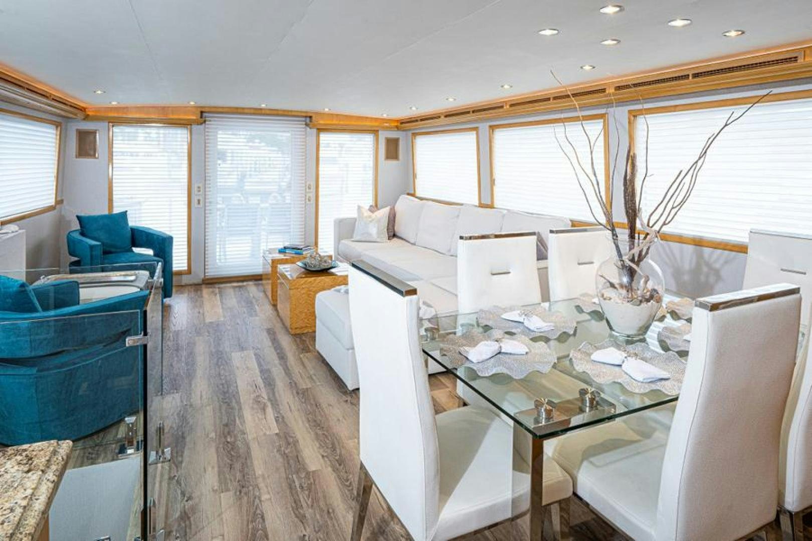 a large room with a table and chairs aboard TUFF LIFE IV Yacht for Sale