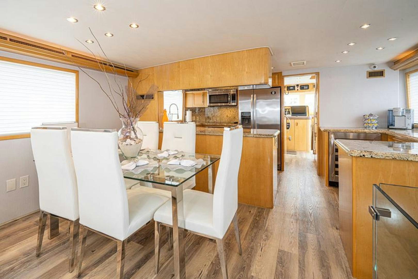 a kitchen with a dining table aboard TUFF LIFE IV Yacht for Sale