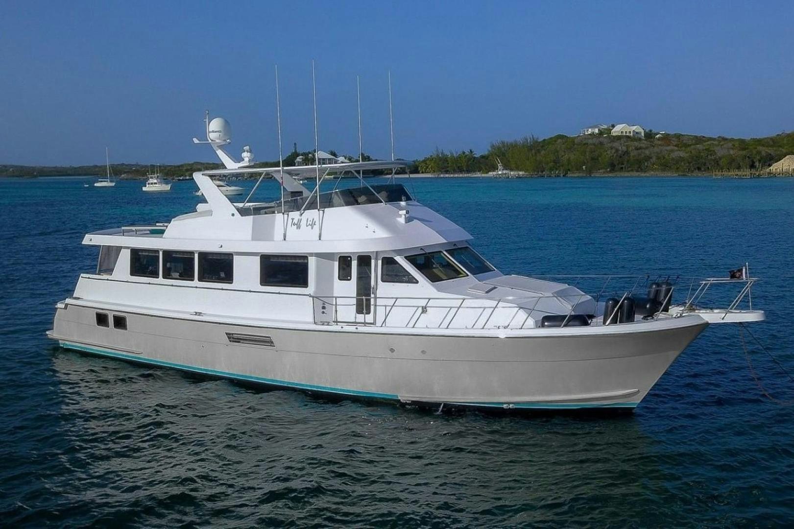 a white yacht in the water aboard TUFF LIFE IV Yacht for Sale