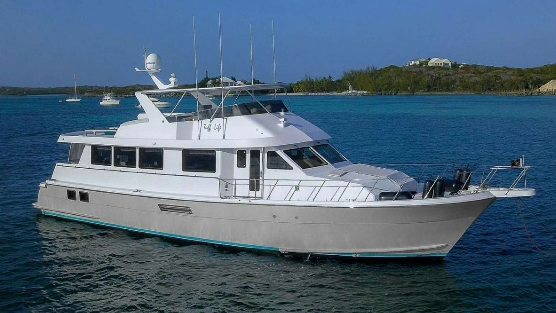 a white yacht in the water aboard TUFF LIFE IV Yacht for Sale