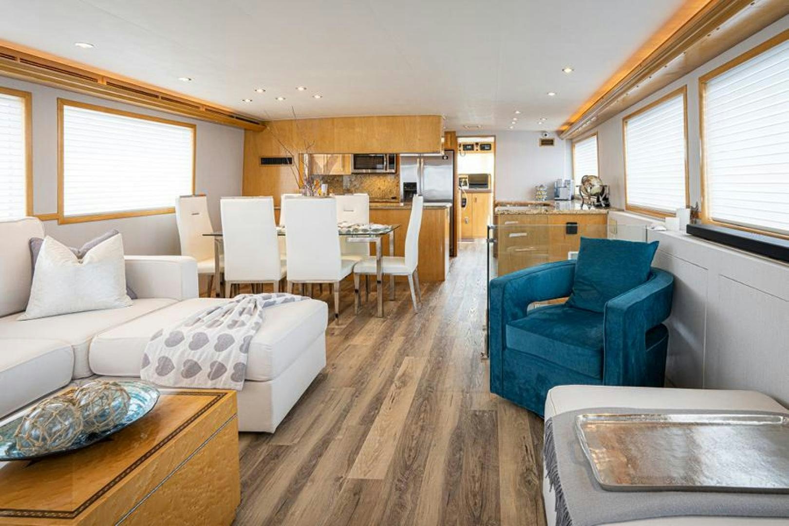 a living room with a kitchen and dining room aboard TUFF LIFE IV Yacht for Sale
