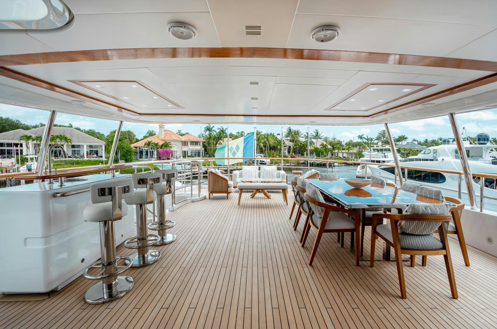 a room with tables and chairs aboard ALLORA Yacht for Sale