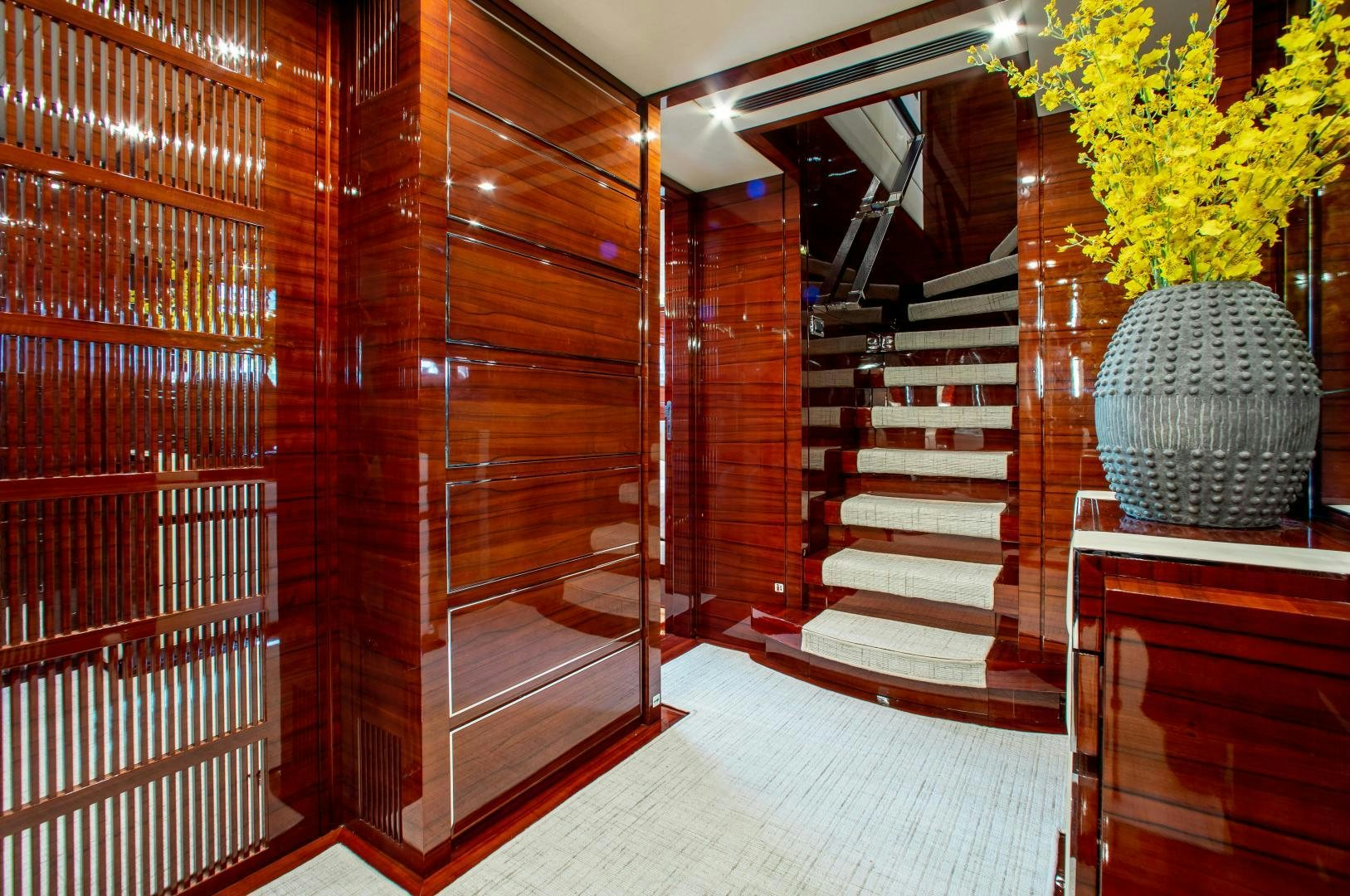 a room with wooden walls and a staircase aboard ALLORA Yacht for Sale