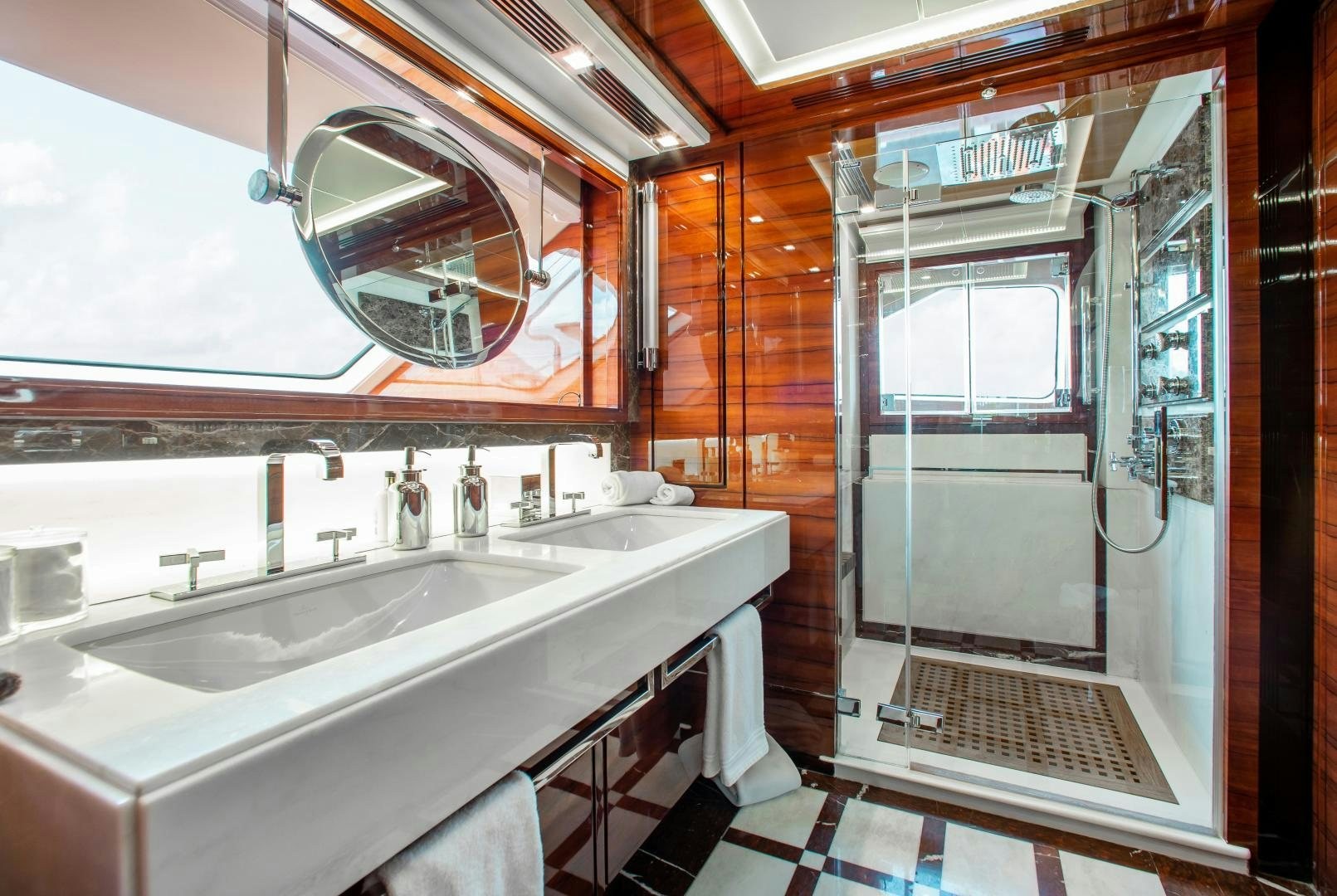 a bathroom with a large mirror aboard ALLORA Yacht for Sale