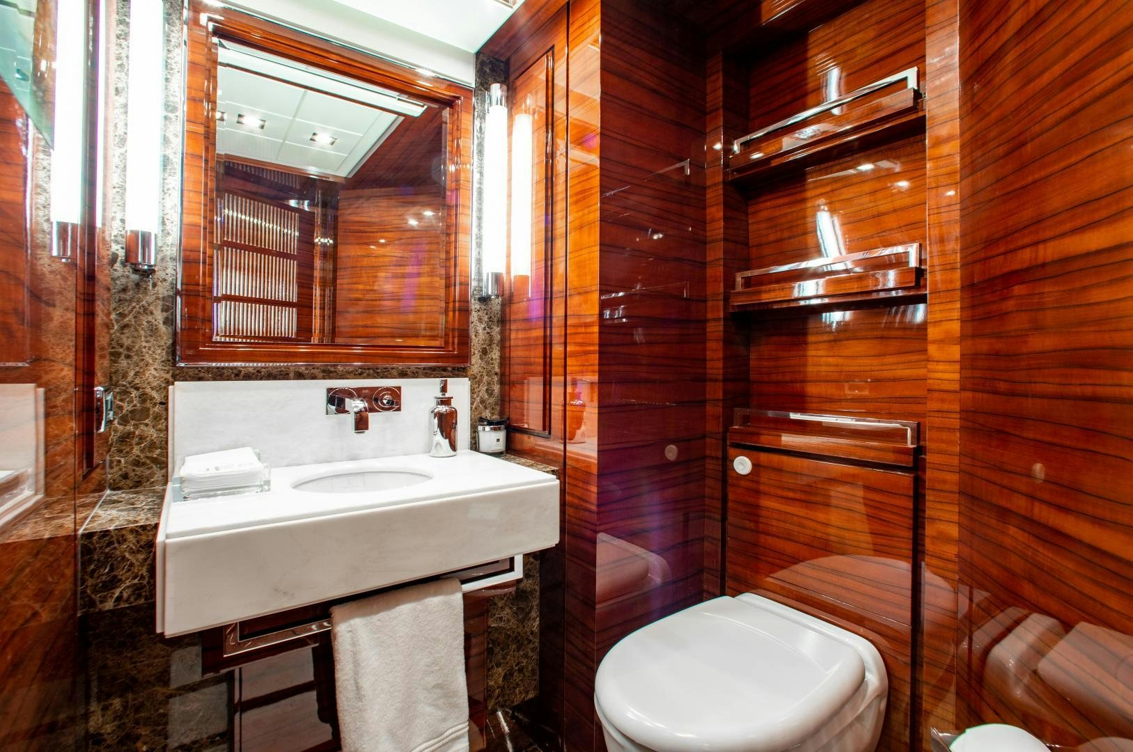 a bathroom with a sink and a toilet aboard ALLORA Yacht for Sale