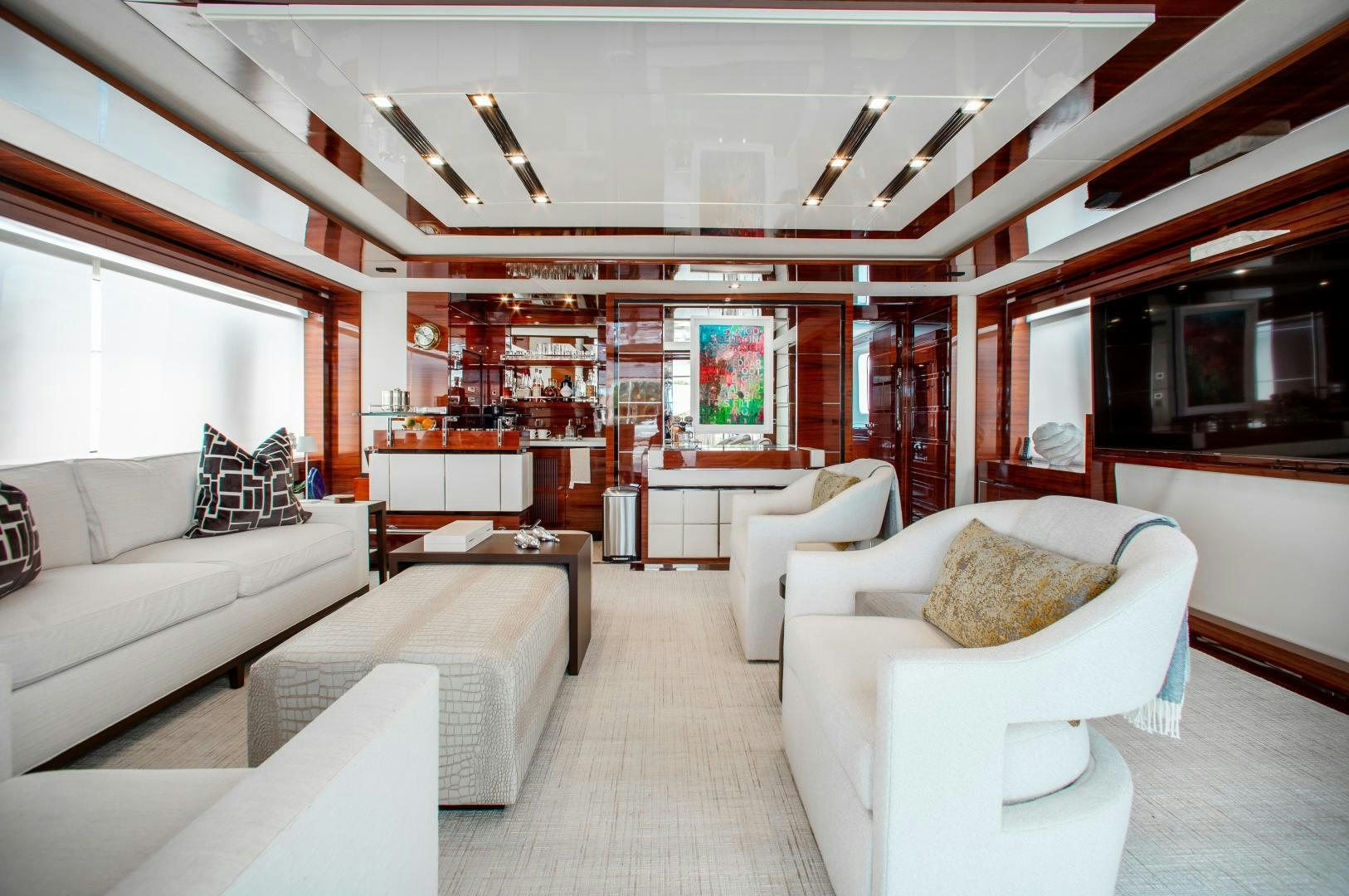 a living room with white furniture aboard ALLORA Yacht for Sale