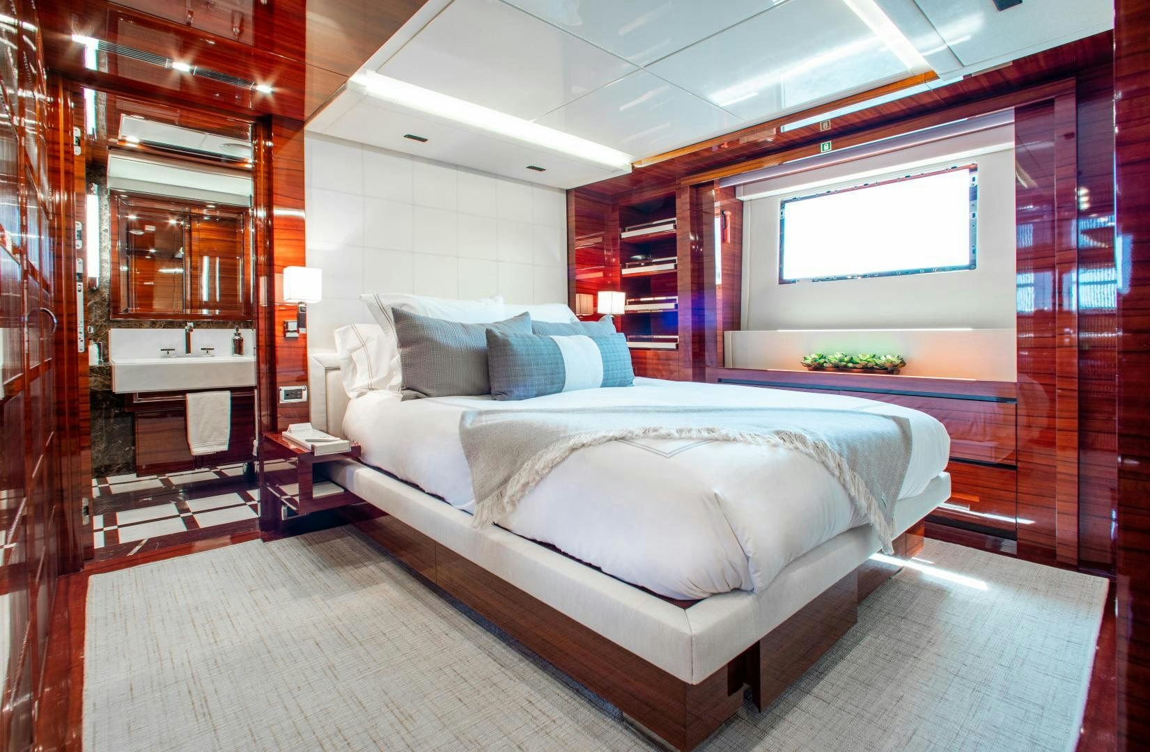 a bed in a room aboard ALLORA Yacht for Sale