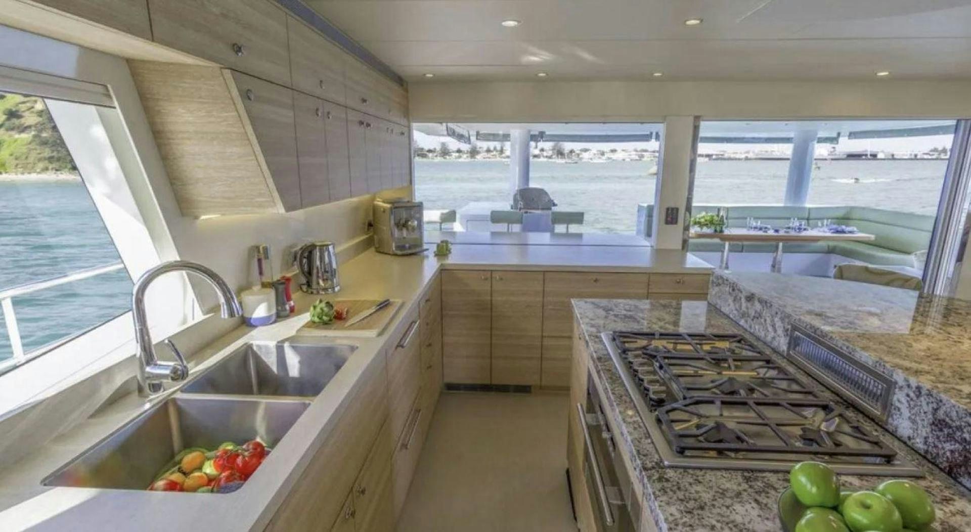 a kitchen with a sink and a stove aboard SAMARA Yacht for Sale