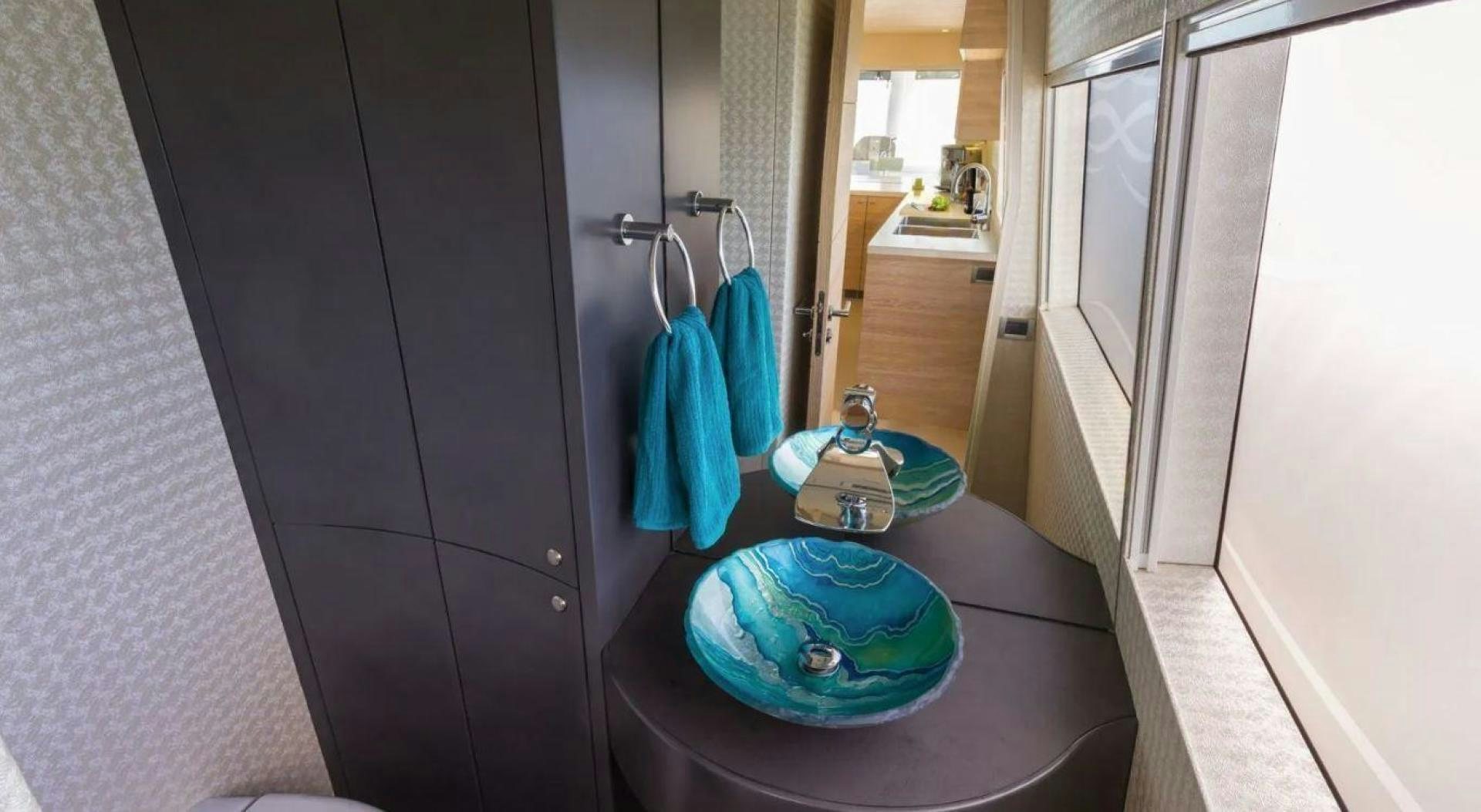a bathroom with a sink and a mirror aboard SAMARA Yacht for Sale