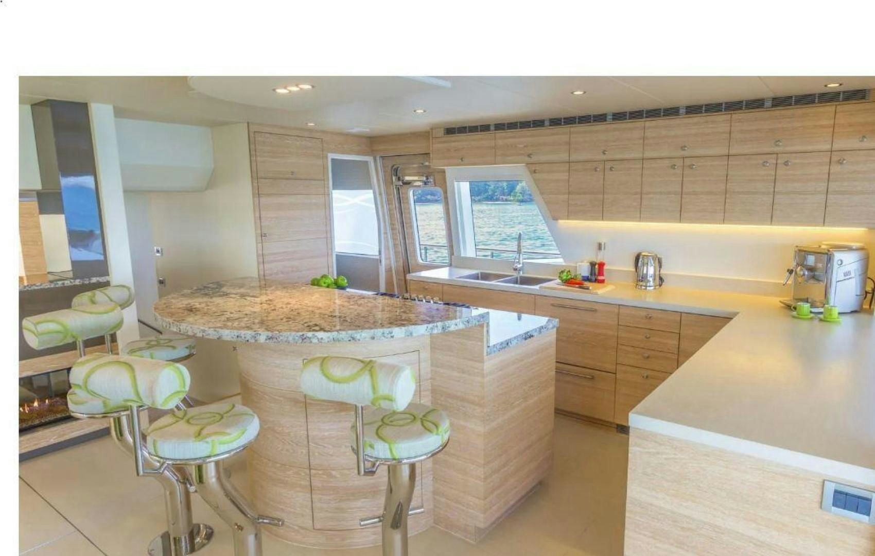 a kitchen with a countertop sink and cabinets aboard SAMARA Yacht for Sale