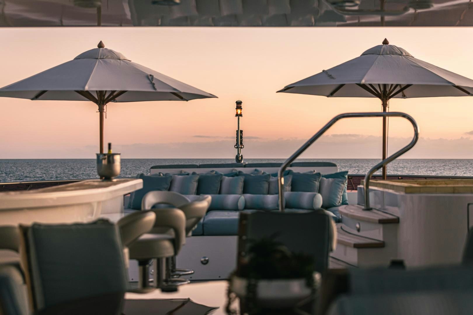 a table with umbrellas on it aboard UNBRIDLED Yacht for Sale