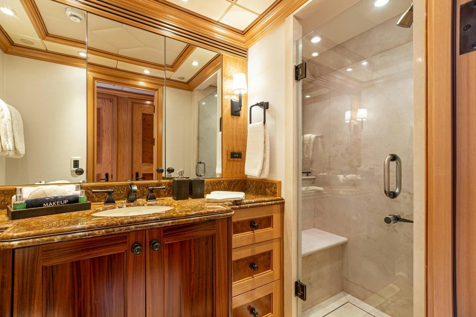 a bathroom with a glass shower aboard UNBRIDLED Yacht for Sale