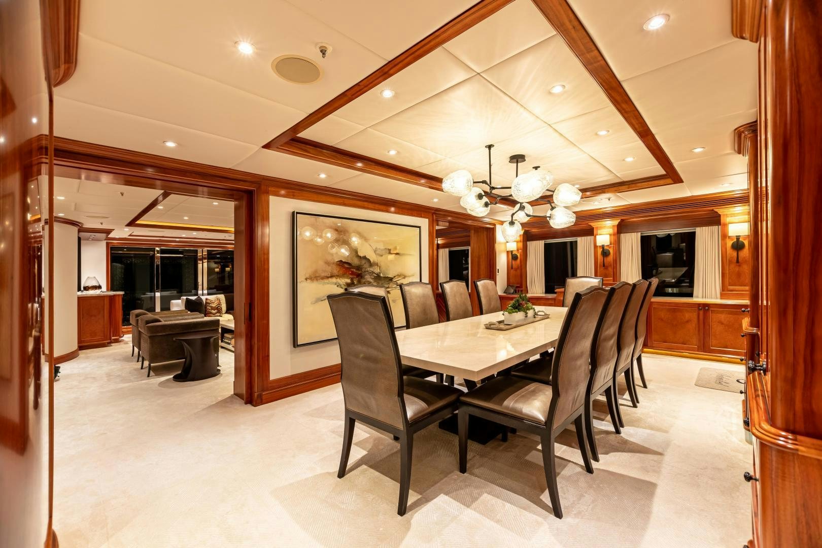 a dining room with a table and chairs aboard UNBRIDLED Yacht for Sale