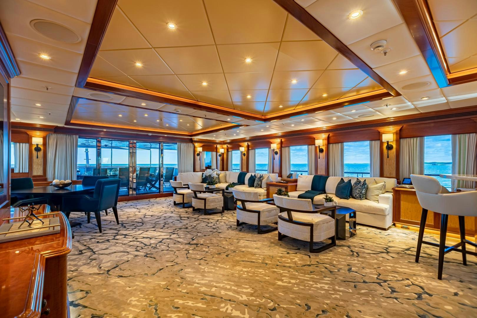 a large living room with a large open floor plan aboard UNBRIDLED Yacht for Charter