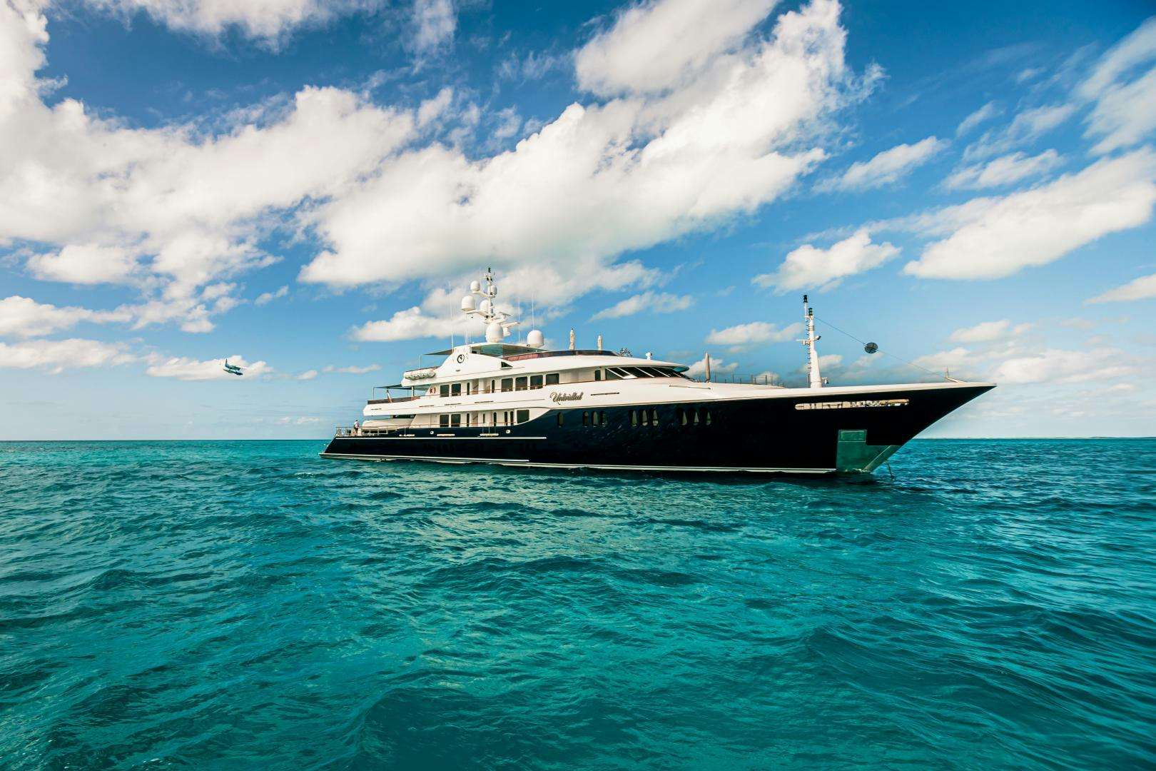 a large ship in the water aboard UNBRIDLED Yacht for Sale