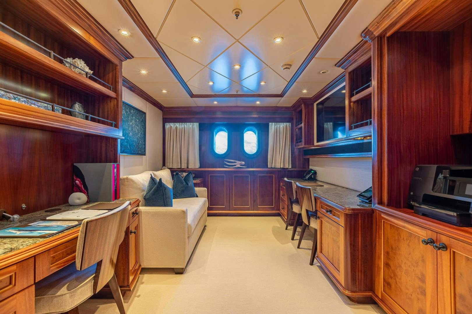 a room with a table and chairs aboard UNBRIDLED Yacht for Sale
