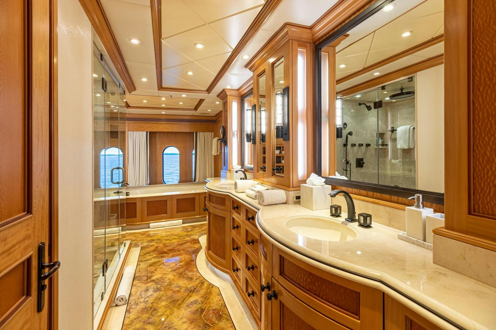 a bathroom with a large mirror aboard UNBRIDLED Yacht for Sale