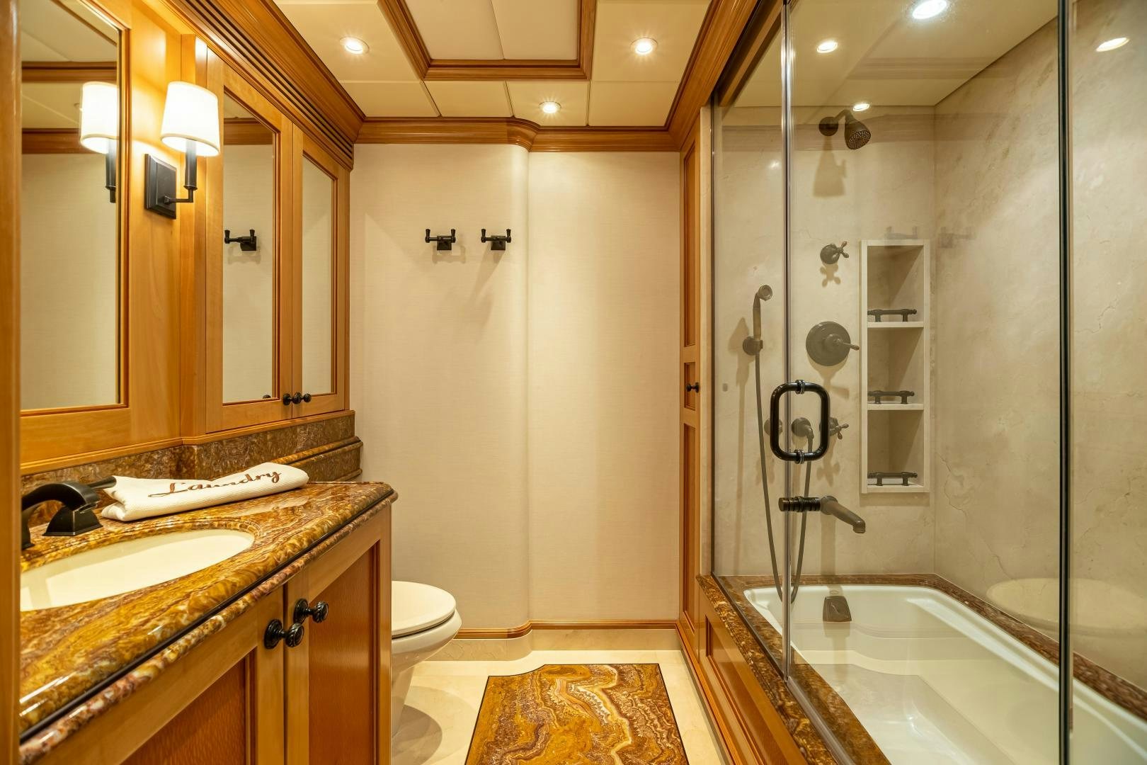 a bathroom with a glass shower aboard UNBRIDLED Yacht for Sale