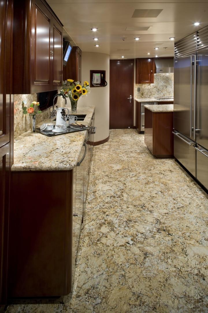 a kitchen with a marble counter top aboard CASINO ROYALE Yacht for Sale