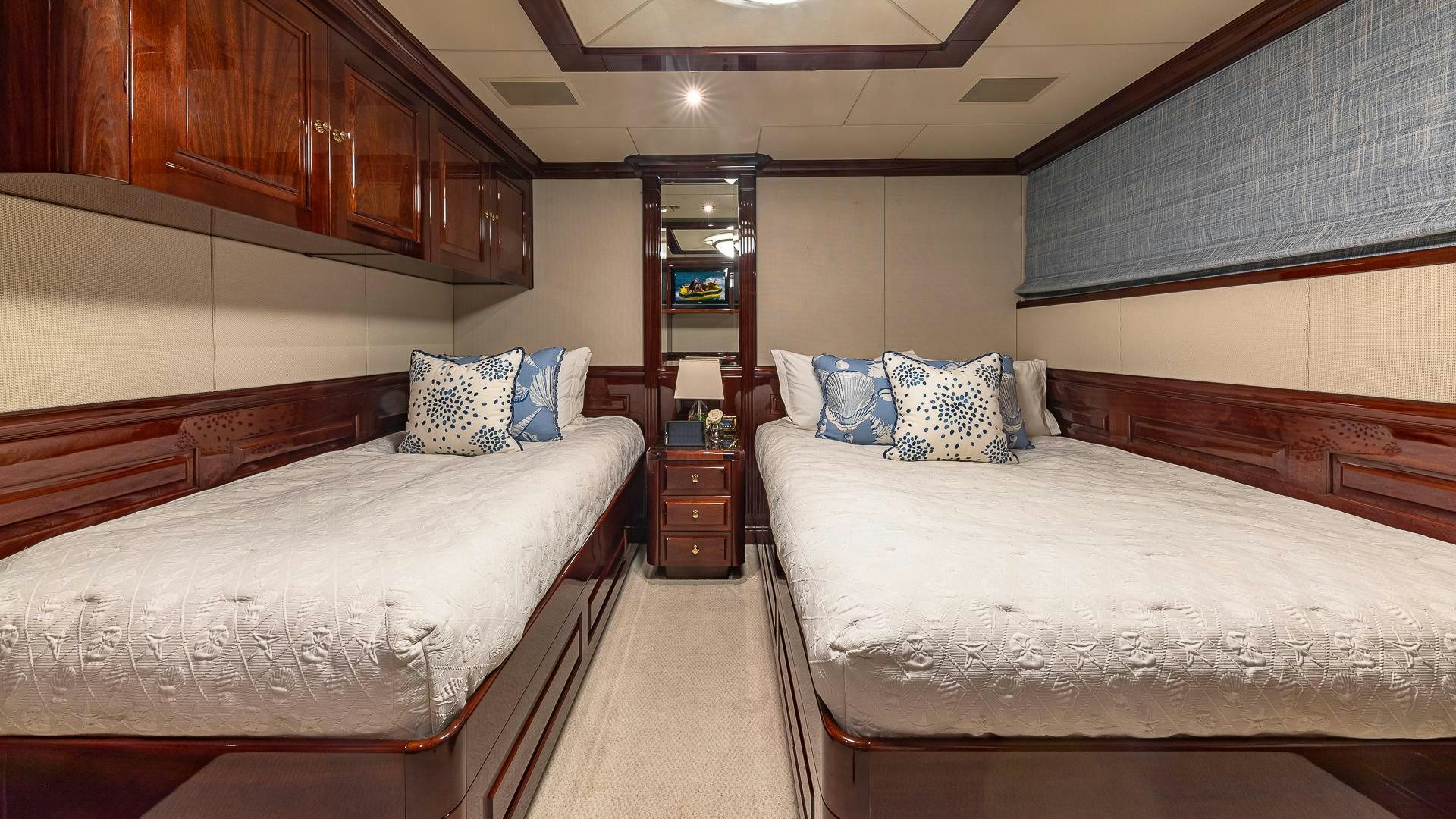 a room with two beds aboard CASINO ROYALE Yacht for Sale