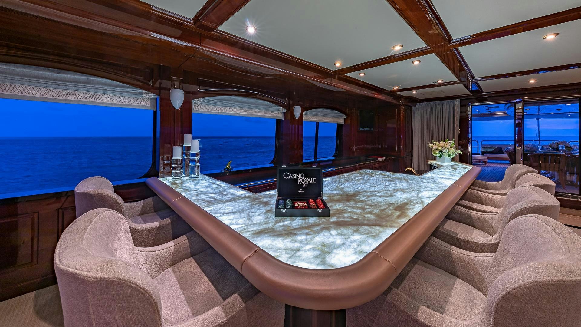 a large pool with a large bed aboard CASINO ROYALE Yacht for Sale