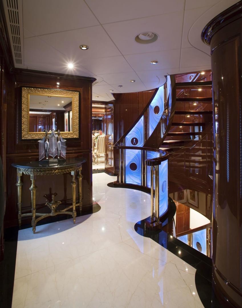 a room with a mirror and a table aboard CASINO ROYALE Yacht for Sale