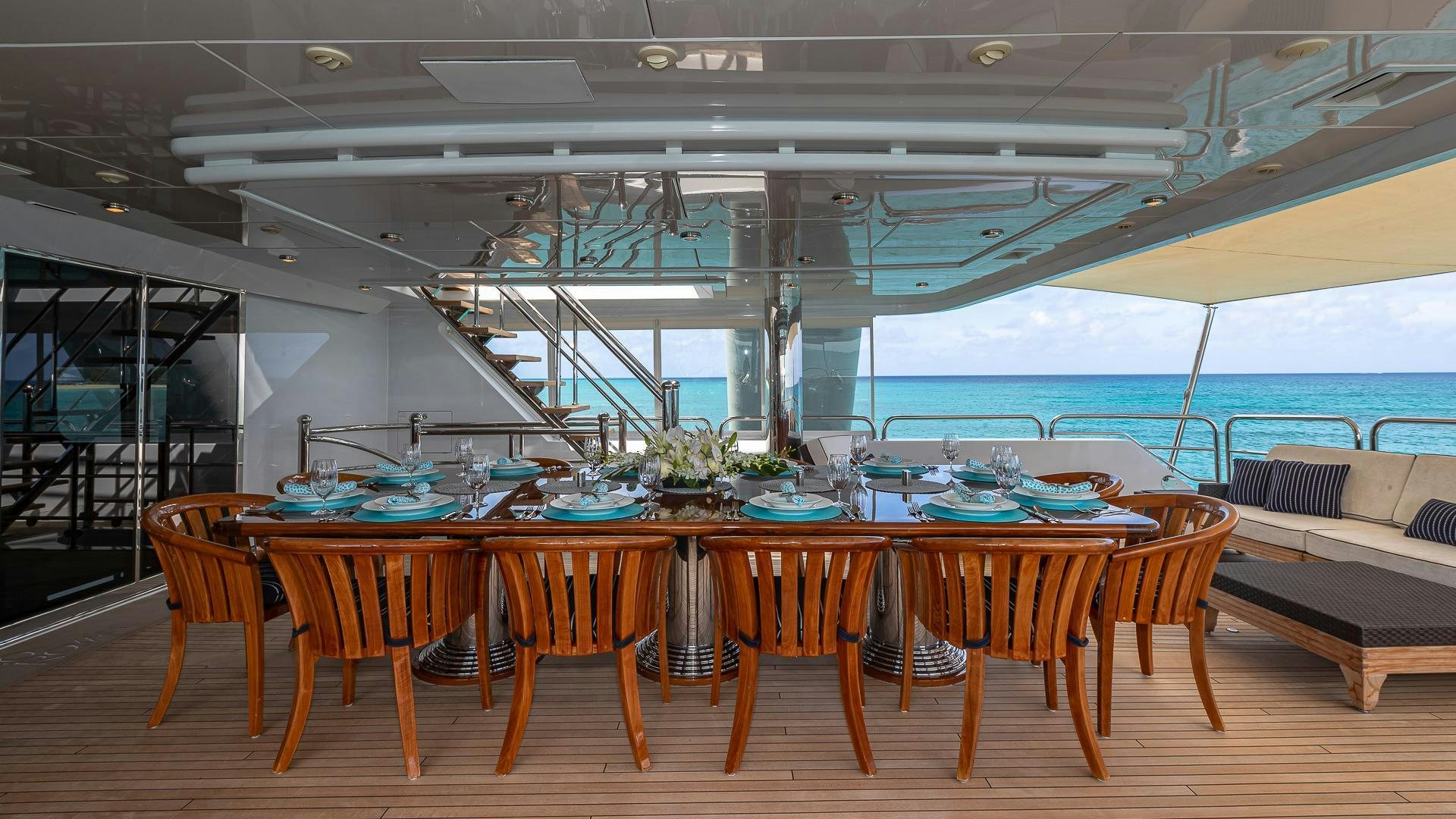 a room with tables and chairs aboard CASINO ROYALE Yacht for Sale